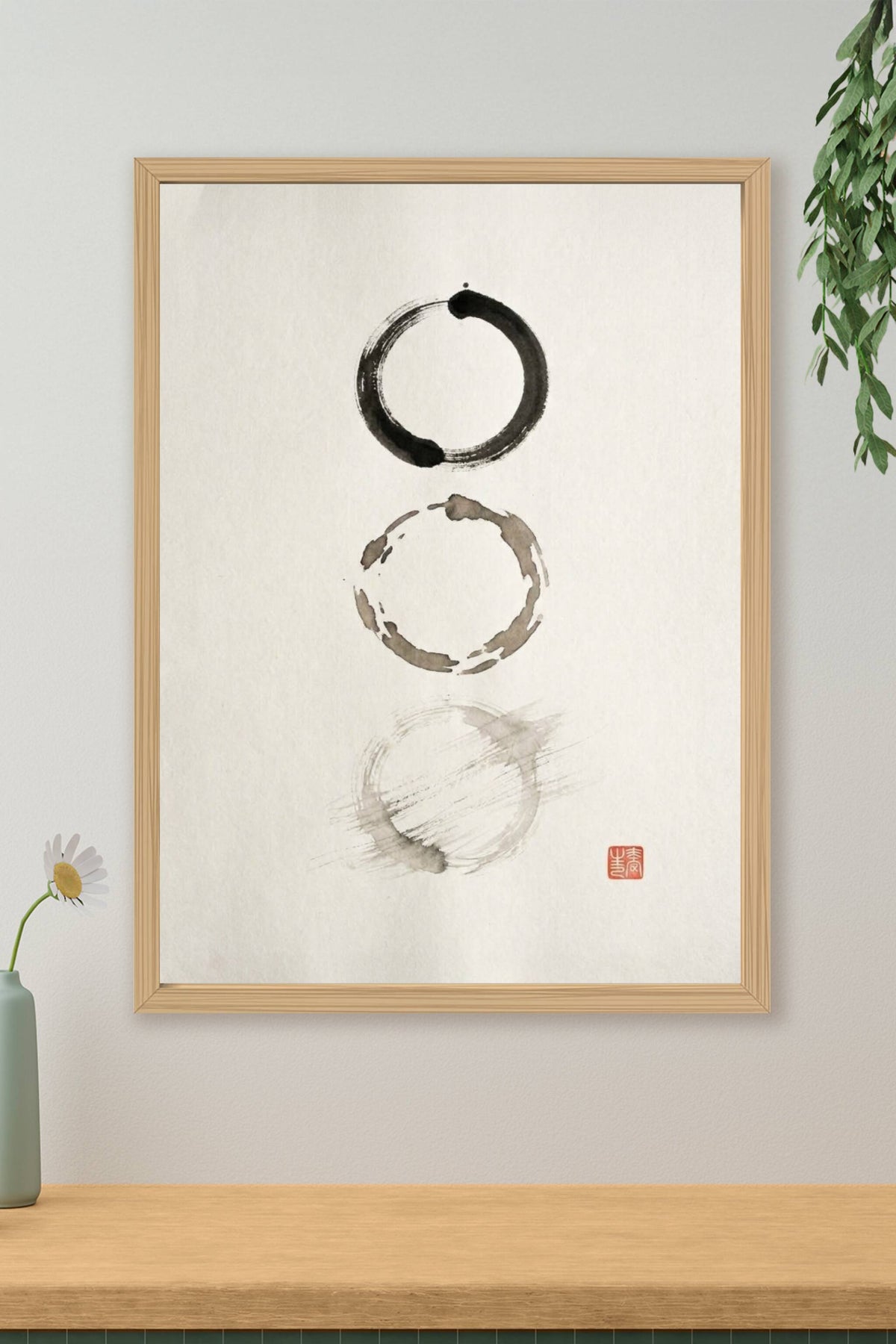 A minimalist sumi-e ink wash artwork showing three imperfect circles arranged vertically on bare paper, each brushed...